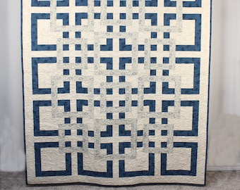 Handmade patchwork throw quilt in blue and cream