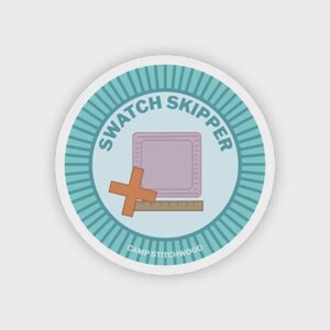 May include: A round sticker with a teal and white striped border. The sticker features the text "SWATCH SKIPPER" in teal, a pink square with a ruler, and an orange cross. The text "CAMP STITCHWOOD" is at the bottom.