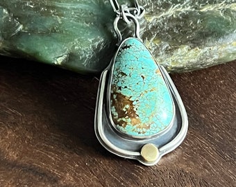 Mine 8 turquoise teardrop sterling silver pendant with gold accents on 18 inch chain
