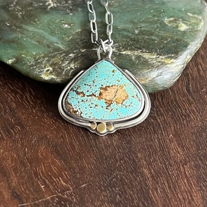 Arizona mine 8 turquoise teardrop sterling silver pendant with gold accents on 16 inch silver chain