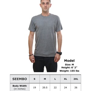 May include: A size chart for a triblend t-shirt showing measurements in inches for body width and length. The chart shows sizes S, M, L, XL, and 2XL. A model wearing a grey t-shirt is shown in the image.