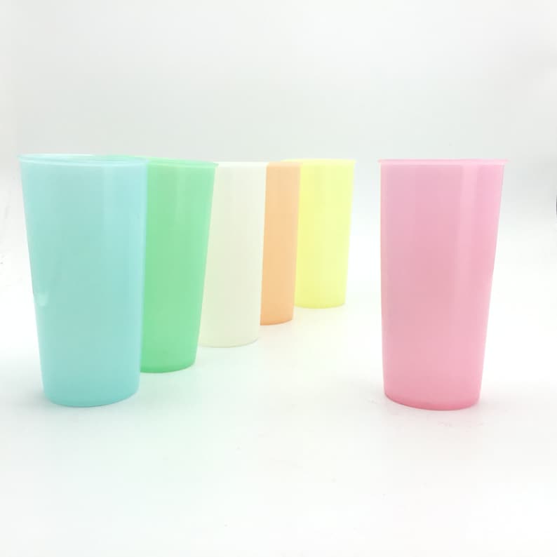 May include: Set of six plastic cups in various pastel colors, including light blue, green, white, peach, yellow, and pink.