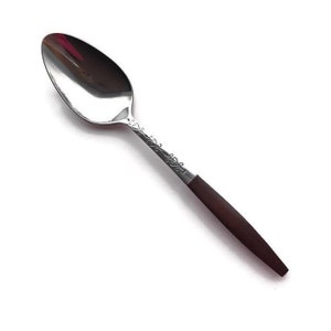 May include: A silver spoon with a brown wooden handle. The spoon has a decorative design on the handle.