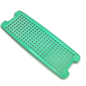 May include: A light green plastic dish drainer with a grid pattern. The drainer has two handles on the sides.