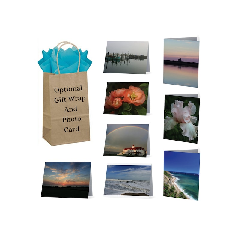 May include: A brown paper gift bag with blue tissue paper inside. The bag has the text "Optional Gift Wrap And Photo Card" printed on it. The image also shows eight different photo cards with various images, including a sunset, a beach, a flower, and a lighthouse.