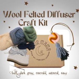 May include: A craft kit for making a wool felted diffuser. The kit includes wool in five colors: buff, dark gray, emerald, oatmeal, and navy. The kit also includes a wooden bead, a felt circle with a swirl design, and a tassel.