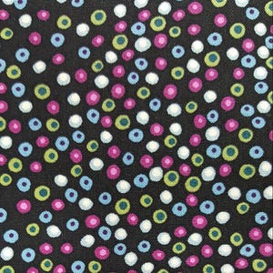 100% cotton Quilting fabric. PRICED by the 1/2 yard & cut on order.  Dots dot and more dots  Black with purple blue green pink Small print
