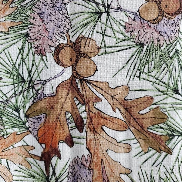 Acorn clusters, pine needles,  oak leaves and pine cones, Packed earthy. 100% cotton Quilting fabric. Sold by the 1/2 yard, cut on order
