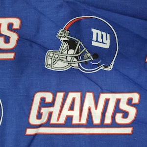 100% cotton Quilting fabric. PRICED by the 1/2 yard cut on order, NY Giants helmet on blue. 60&quot; wide