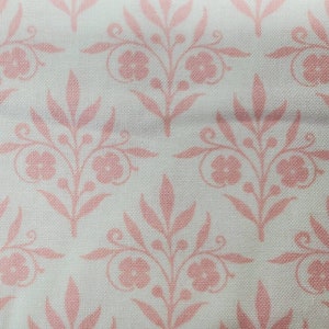 100% cotton Quilting fabric. PRICED by the 1/2 yard cut upon order. clear peachy pink floral.  Nice soft hand, think baby items