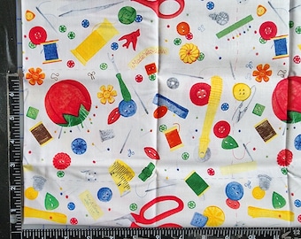 May include: White fabric with a colorful sewing-themed pattern. The design includes red scissors, spools of thread, buttons, measuring tapes, and the text "Made with love". The fabric is decorated with various sewing tools and notions.