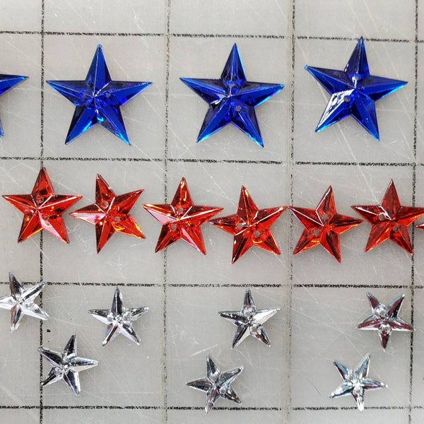 Mirror star red white and blue 2 hole Buttons. Accents scrap book fun. 8 blue, 12 red, 16 clear. Sharp dimensional stars.  USA