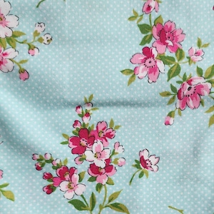 Pre-Cut PLEASE read description 100% cotton quilting fabric. PRICED by the 1/2 yard.  Baby turquoise, tiny white dots, floral, flowers