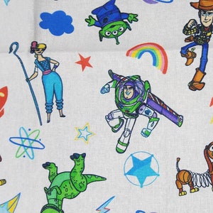 Toy story print. 100% cotton Quilting fabric Pre-cut FAT 1/4 yard. Sheriff Woody, Buzz & others tossed