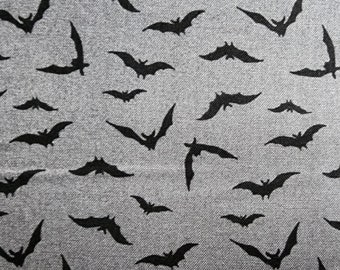 100% cotton Quilting fabric.  PRICED by the 1/2 yard and cut on order.  Spooky Halloween bat bats vampire, fun. Black on medium grey gray