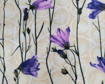 100% quilting cotton fabric,  Hoffman.   PRICED by the 1/2 yard. Buttery cream background with small purple flowers and stems allover.