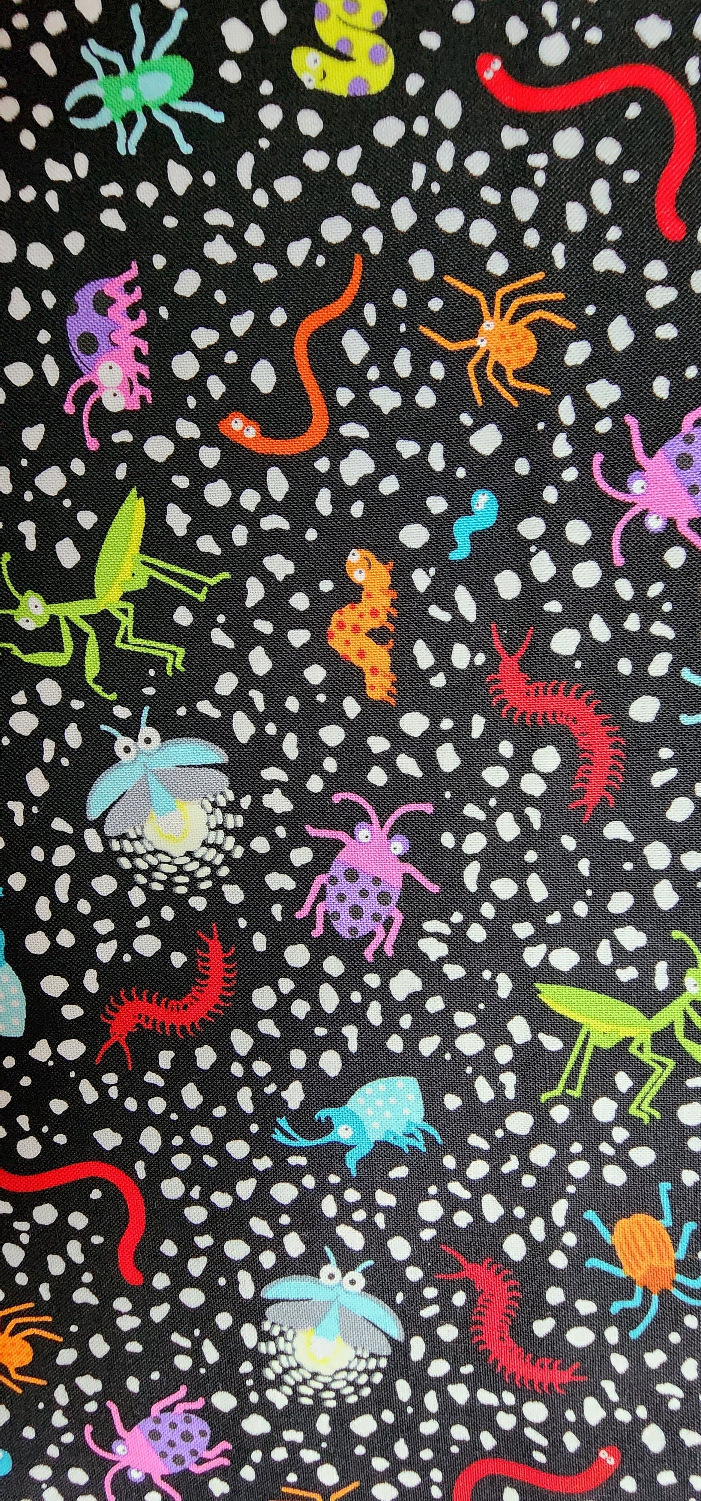 100% cotton Quilting fabric PRICED by the 1/2 yard, cut on order.  Bugs insects worms on black background.  Just too fun