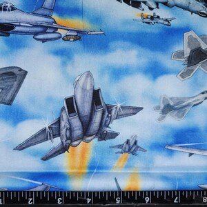 End of the bolt 1 yd and 3" x44". 100% cotton Quilting fabric.  Cool USA America military airplanes jets fighter planes. On sky background.