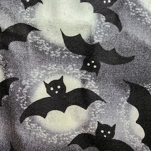 100% cotton Quilting fabric.  PRICED by the 1/2 yard and cut on order.  Spooky Halloween bat bats vampire vampires, fun. Grey Black white.
