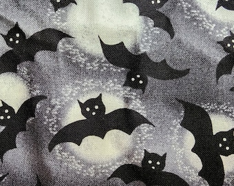 100% cotton Quilting fabric.  PRICED by the 1/2 yard and cut on order.  Spooky Halloween bat bats vampire vampires, fun. Grey Black white.
