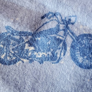 100% cotton Flannel. PRICED by the 1/2 yard.  Blue blues motorcycle scattered all over.  Soft nice warm for winter pillowcases.