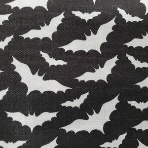100% cotton Quilting fabric.  PRICED by the 1/2 yard and cut on order.  Spooky Halloween bat bats vampire vampires, fun. Black and white.