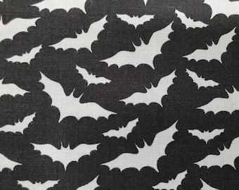 100% cotton Quilting fabric.  PRICED by the 1/2 yard and cut on order.  Spooky Halloween bat bats vampire vampires, fun. Black and white.
