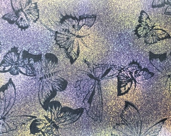 100% quilting cotton,   PRICED by the half 1/2 yard. Mottled purple with black outlines of butterfly butterflies scattered all over.  DP