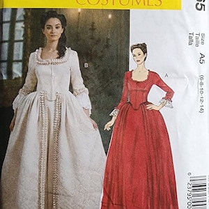 May include: McCall's Costumes pattern M7965 features two historical dress designs. One dress is white with a square neckline and long sleeves. The other is red with a similar design. The pattern size is A5, for sizes 6-8-10-12-14.