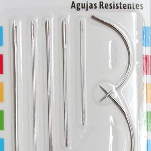May include: A package of heavy-duty hand needles. The package includes straight needles and curved needles. The text on the package reads "Heavy Duty Hand Needles", "Aiguilles à main résistantes", and "Agujas Resistentes". The package contains 7 needles.