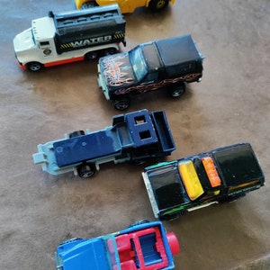 Lot of six 1980-1991 Hot Wheels Work trucks, Jeep, Harley Ford Bronco and Blazer Die Cast Replicas.