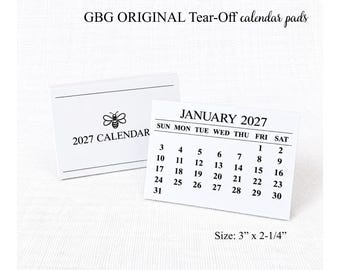 May include: Two white tear-off calendar pads featuring the text GBG ORIGINAL Tear-Off calendar pads and 2027 CALENDAR with a bee icon. One pad shows the January 2027 monthly grid. The dimensions are listed as 3 inches by 2.25 inches.