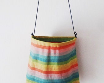 Clothes pin bag with colorful stripes will hold plenty of clothes pins on your line, or plastic bags in your laundry room to hang on hook