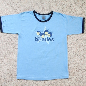 Beatles tee shirt from the 60&#39;s in very nice vintage shape, makes a great gift for music geek or memorabilia buff very wearable or frameable