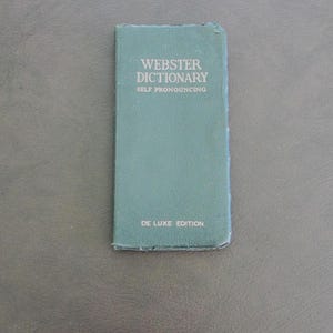 Webster Dictionary self Pronouncing Deluxe Edition made in U.S.A. in good but used condition in a nice pocket size