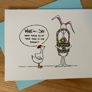 Carte de Pâques : Oeufs dans un panier Cartoon