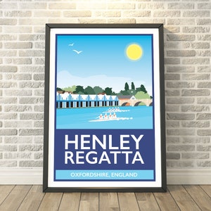 May include: A framed poster of the Henley Regatta. The illustration shows rowers on a river, a blue sky, and a yellow sun. The poster has the text "HENLEY REGATTA" and "OXFORDSHIRE, ENGLAND" in white on a blue background, evoking a sense of place.