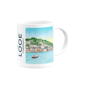May include: White ceramic mug with a colorful illustration of the town of Looe, Cornwall, England. The illustration shows a waterfront scene with buildings, trees, and a small boat in the water.