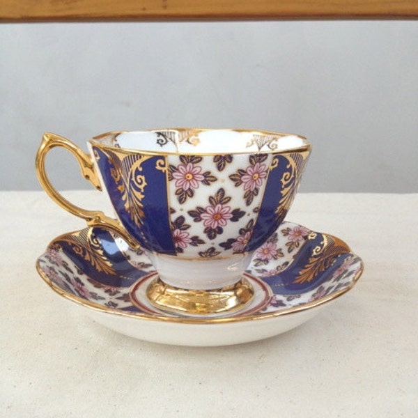 Royal blue purple, Gold, floral pattern, 1930's Vintage Teacup and saucer with color block stripes, Royal Bone China