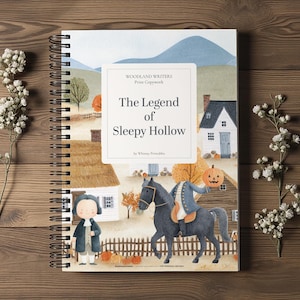 May include: A spiral-bound workbook titled Woodland Writers Print Copywork: The Legend of Sleepy Hollow by Whimsy Printables. The cover features a watercolor illustration of a headless horseman on a black horse holding a pumpkin near a house.
