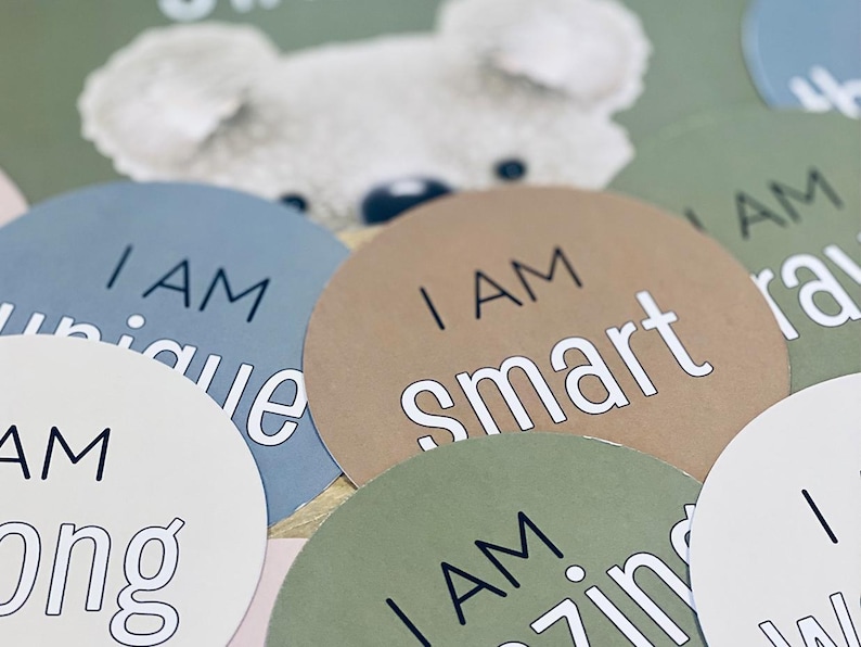 May include: A set of six round, colorful paper circles with the text "I am" followed by a positive affirmation. The affirmations are "unique", "smart", "strong", "amazing", "brave", and "wonderful".