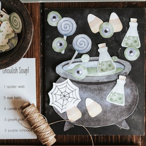 May include: A collection of Halloween-themed paper cutouts and craft supplies. Includes a cauldron, potion bottles, candy corn, lollipops, and an owl. A list titled "Ghoulish Soup!" is also present, along with twine and number cutouts. The color palette is muted with shades of gray, green, and orange.