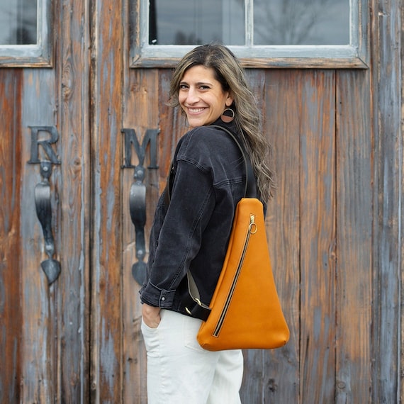 Triangle sling bag deals