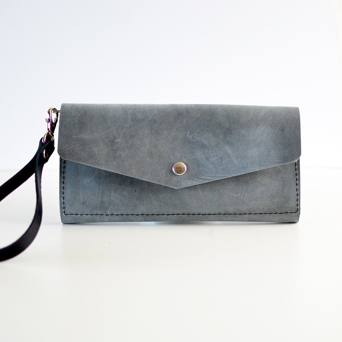 gray leather wristlet