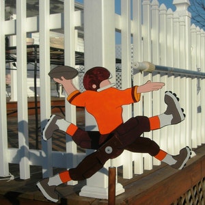 Football Player whirligig-- just tell us your team and we will try and match it up.