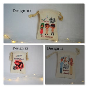 May include: Three different designs for small fabric gift bags with a drawstring closure. The bags feature colorful cartoon illustrations of children celebrating Eid Mubarak. The first bag has a design of three children with the name "Salma" and the text "Eid Mubarak". The second bag has a design of a girl holding balloons with the text "Eid Mubarak". The third bag has a design of two children holding lanterns with the text "Ramadan Mubarak".