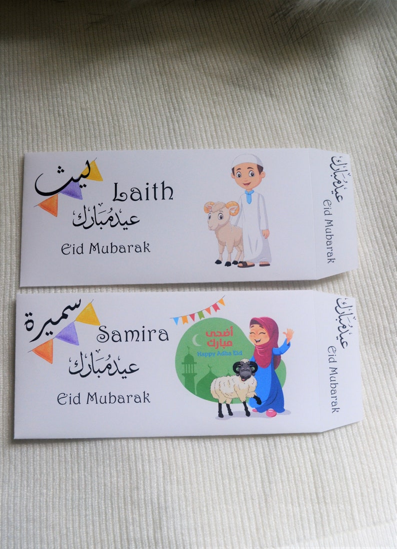 May include: Two colorful Eid Mubarak cards with Arabic text and illustrations of children with sheep. The top card features a boy in a white robe and the bottom card features a girl in a pink headscarf.