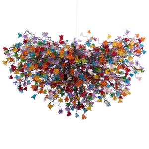 May include: A colourful chandelier featuring numerous glass flowers in shades of red, orange, yellow, green, blue, purple, and pink. The flowers are arranged in a cascading pattern, creating a whimsical and elegant look.
