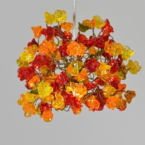 Pendant lighting, kitchen island lighting with warm color roses flowers.