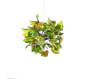 Iluminación colgante, iluminación de isla con tonos de flores y hojas de color verde.